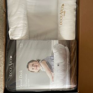 Dock a tot brand new, never used, still all packed up dockAtot grand 9-36 months